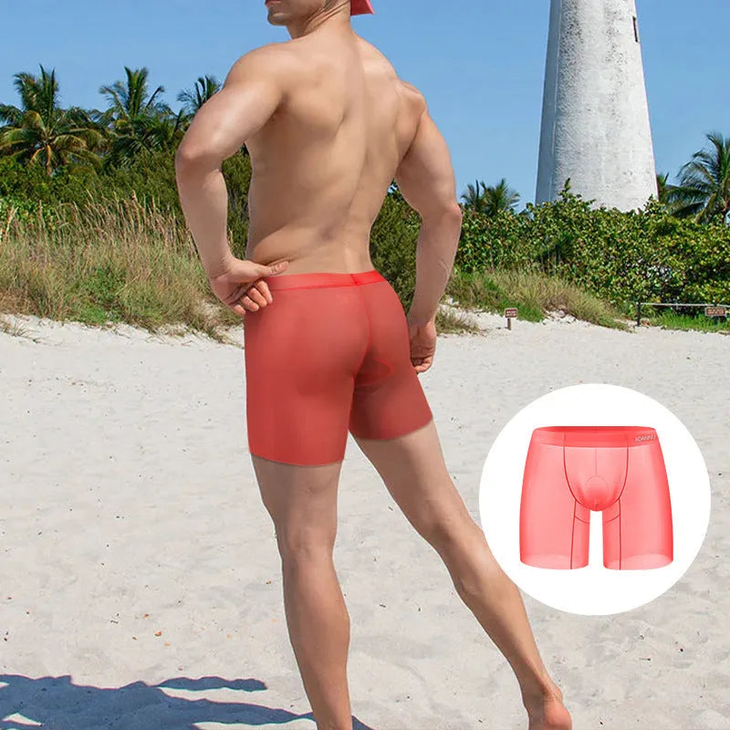 Men's low-waist boxers in solid orange, pink, and red colours made from knitted nylon ice silk fabric.