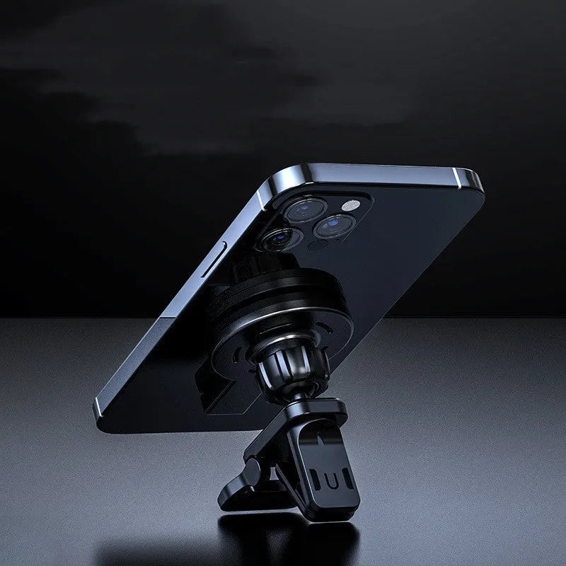 White and black magnetic wireless charger on a desk with a mobile phone