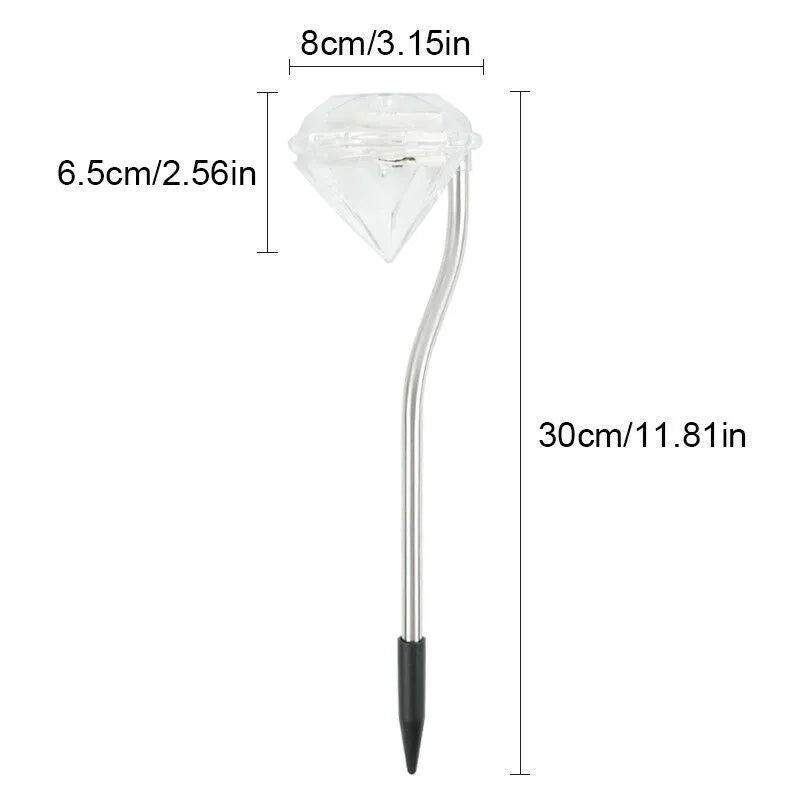 White solar-powered LED garden spotlight with adjustable head on a stake for outdoor use.