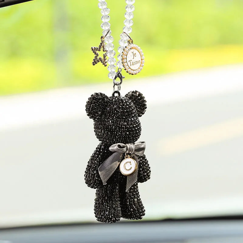 White, pastel, and black Violent Bear car mirror pendant with rhinestones, 5cm by 9cm.