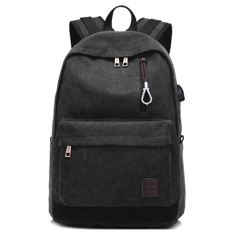 Canvas backpack with USB charging port shown in grey, featuring a laptop sleeve and front zipper pocket.