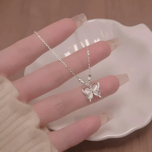 Silver butterfly necklace with square line opal detail on cross chain