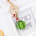 Green watermelon-shaped zinc alloy keychain measuring 12cm with fruit design details