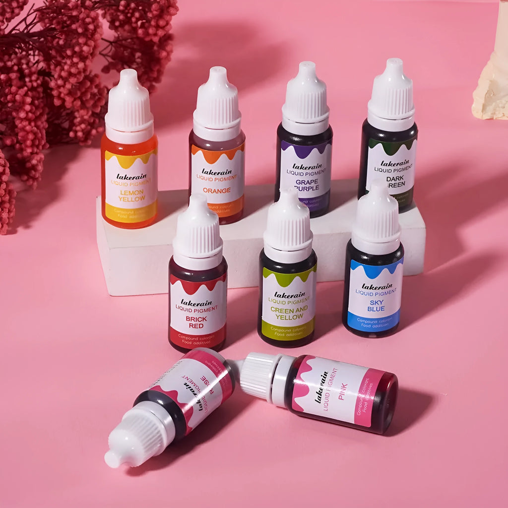 Set of 24 small bottles of pigment colours for handmade soap and food colouring with crafting tools.