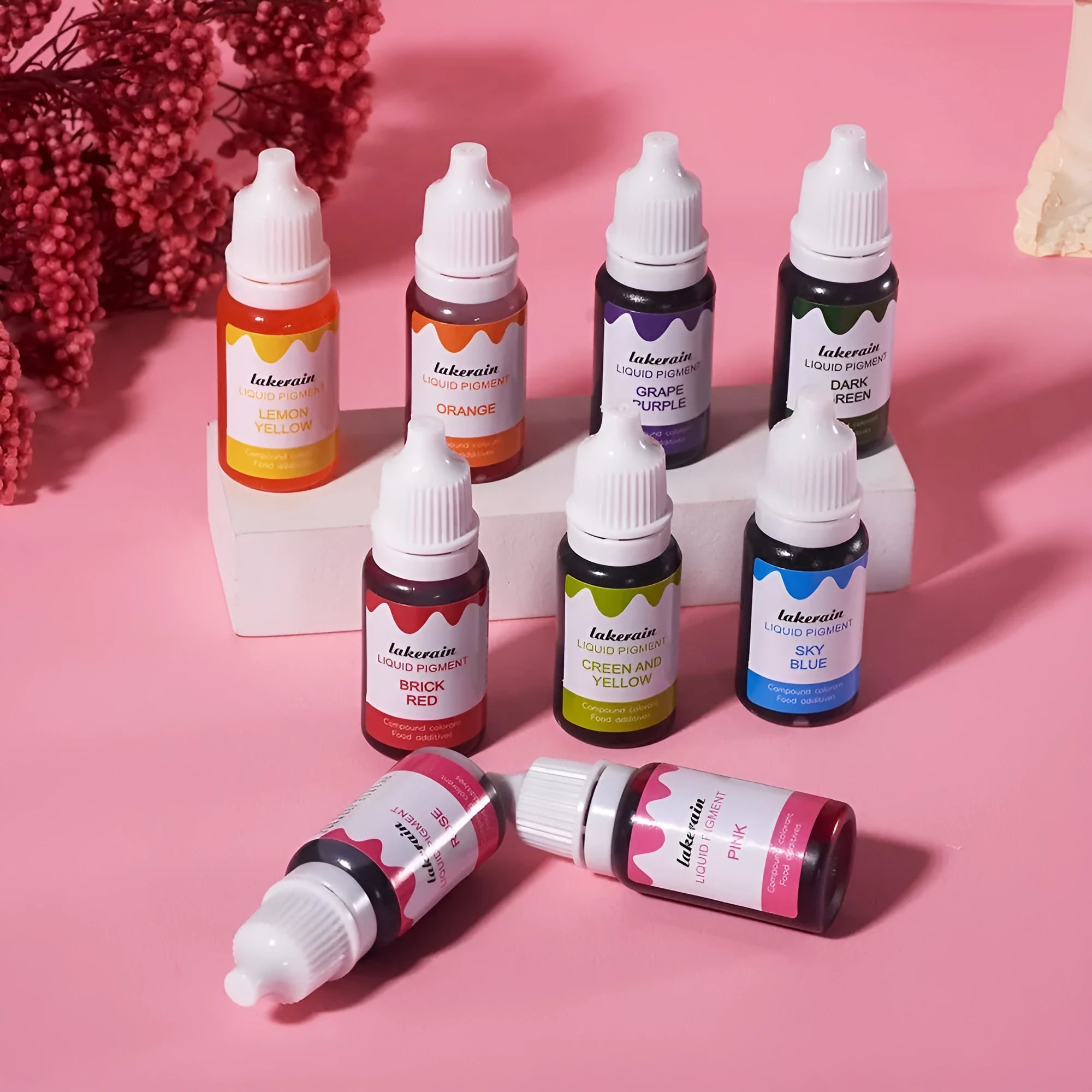 Set of 24 small bottles of pigment colours for handmade soap and food colouring with crafting tools.