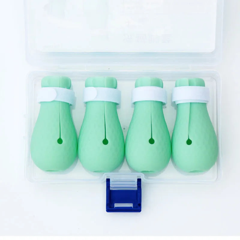 Four silicone cat paw covers for anti-scratch protection during grooming and care
