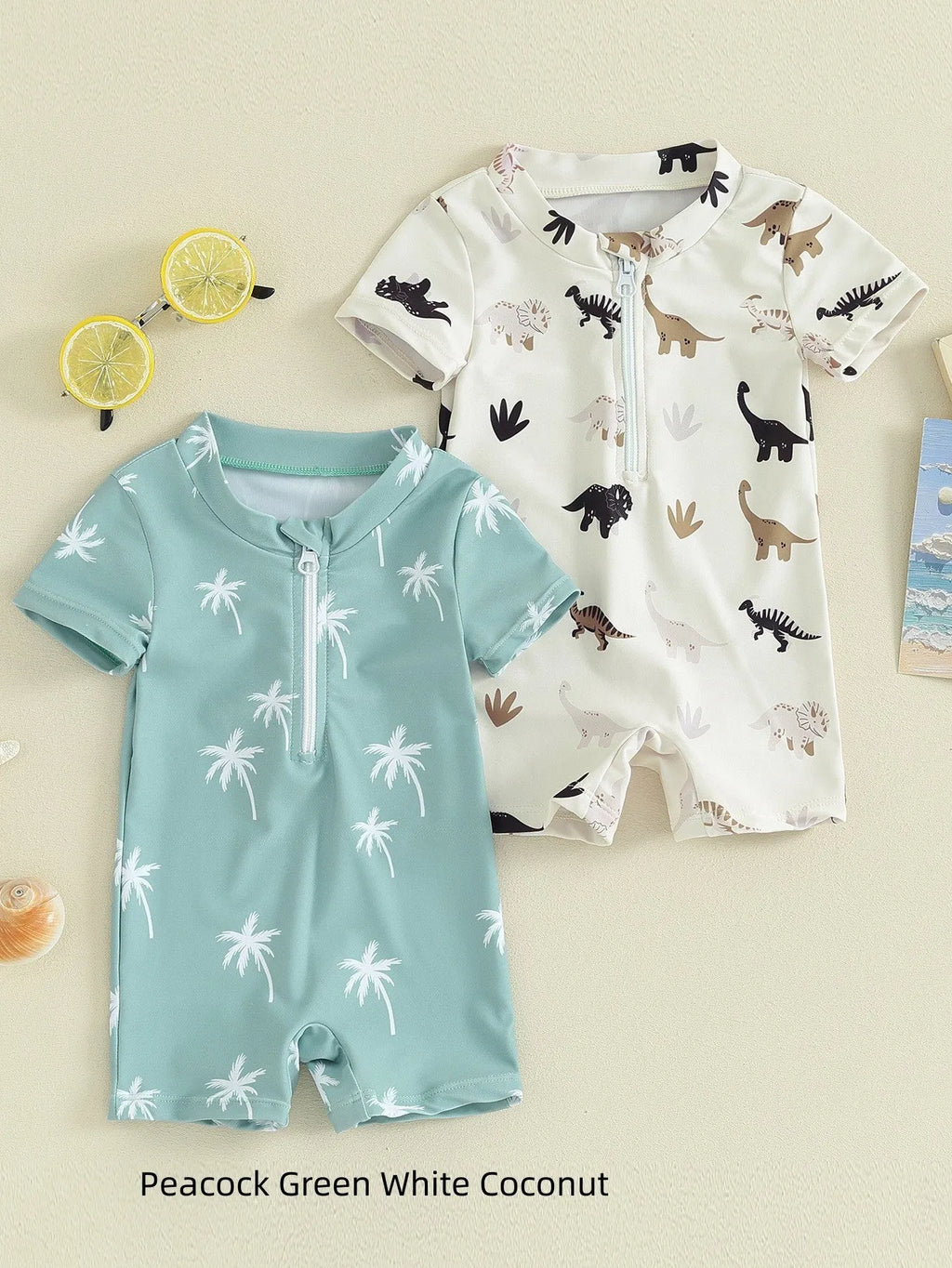 Children's polyester swimsuit in peacock green white coconut tree print and ivory white black coffee dinosaur print, sizes 70-110