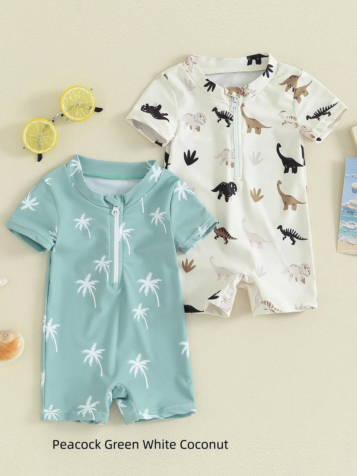 Children's polyester swimsuit in peacock green white coconut tree print and ivory white black coffee dinosaur print, sizes 70-110