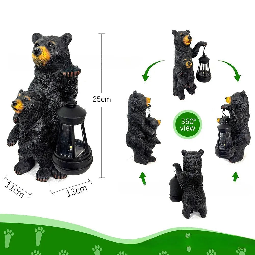 Resin black bear mother and child lantern ornament on a wooden shelf with soft glow