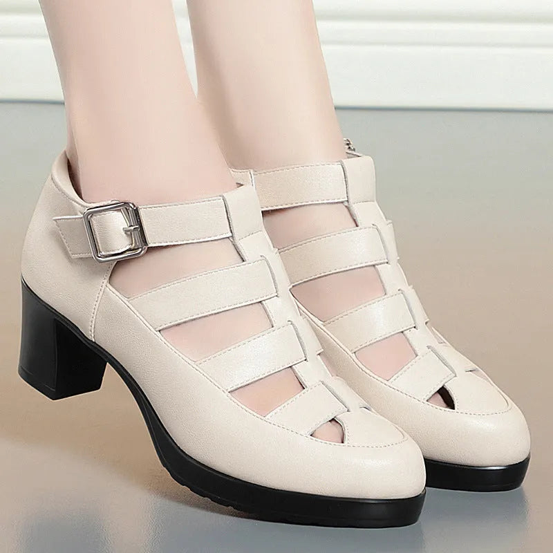 Women's beige closed toe sandals with a chunky heel, woven ankle strap, and back zipper.