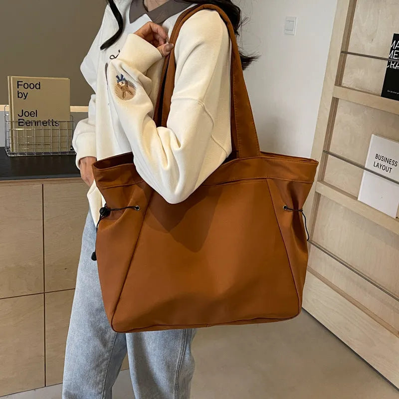Soft foldable Oxford cloth women's shoulder tote bag shown in available colours: black, brown, dark grey, light grey, purple.