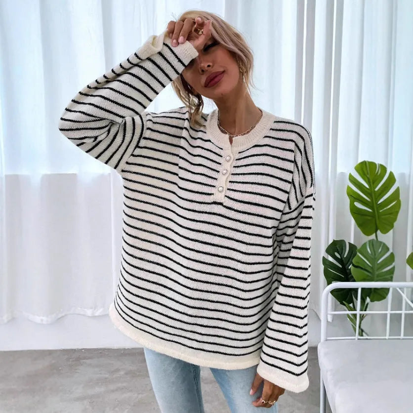 Black striped women's casual top with drop shoulders and button details on viscose knit fabric