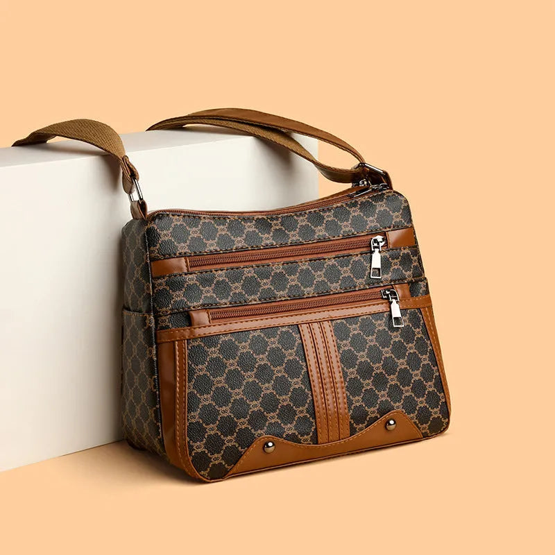 Women's large-capacity crossbody bag in brown or white with PU outer, polyester lining, and stitching pattern