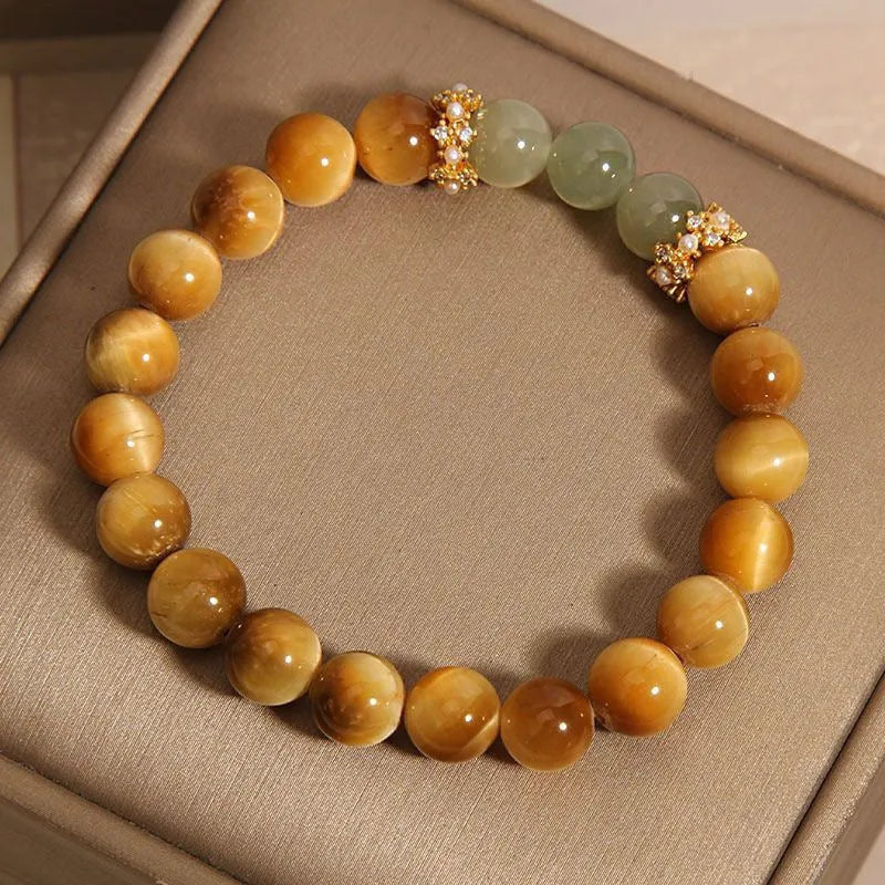 Natural yellow Tiger's Eye Hetian Jade bracelet with U-shaped design and auspicious patterns