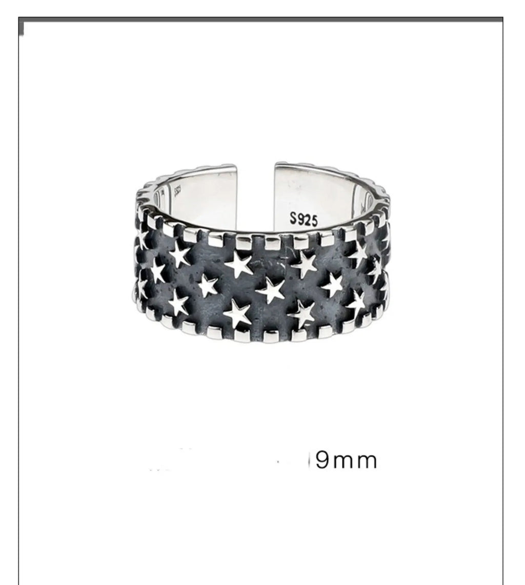 Adjustable opening sterling silver ring with a five-pointed star geometric design.