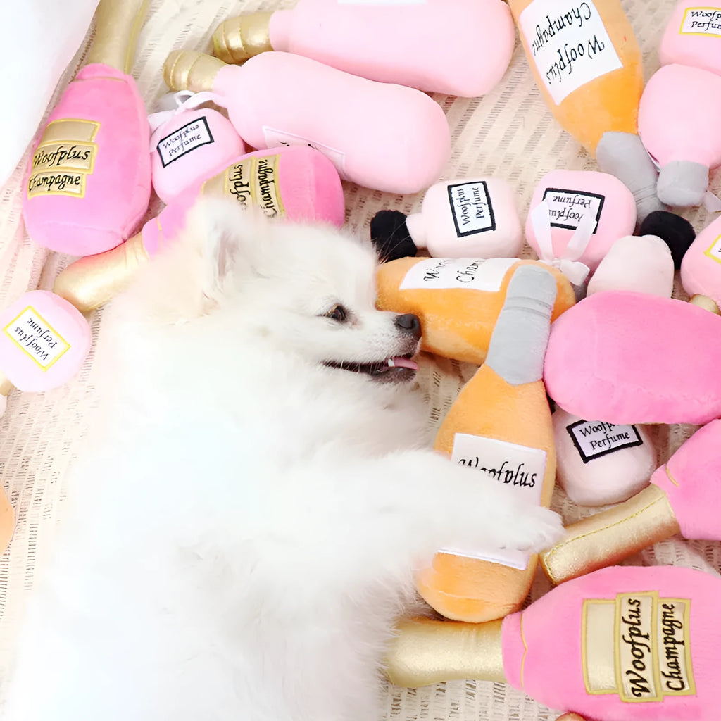 Soft plush pet toy in the shape of a wine bottle, shown in multiple colour options.