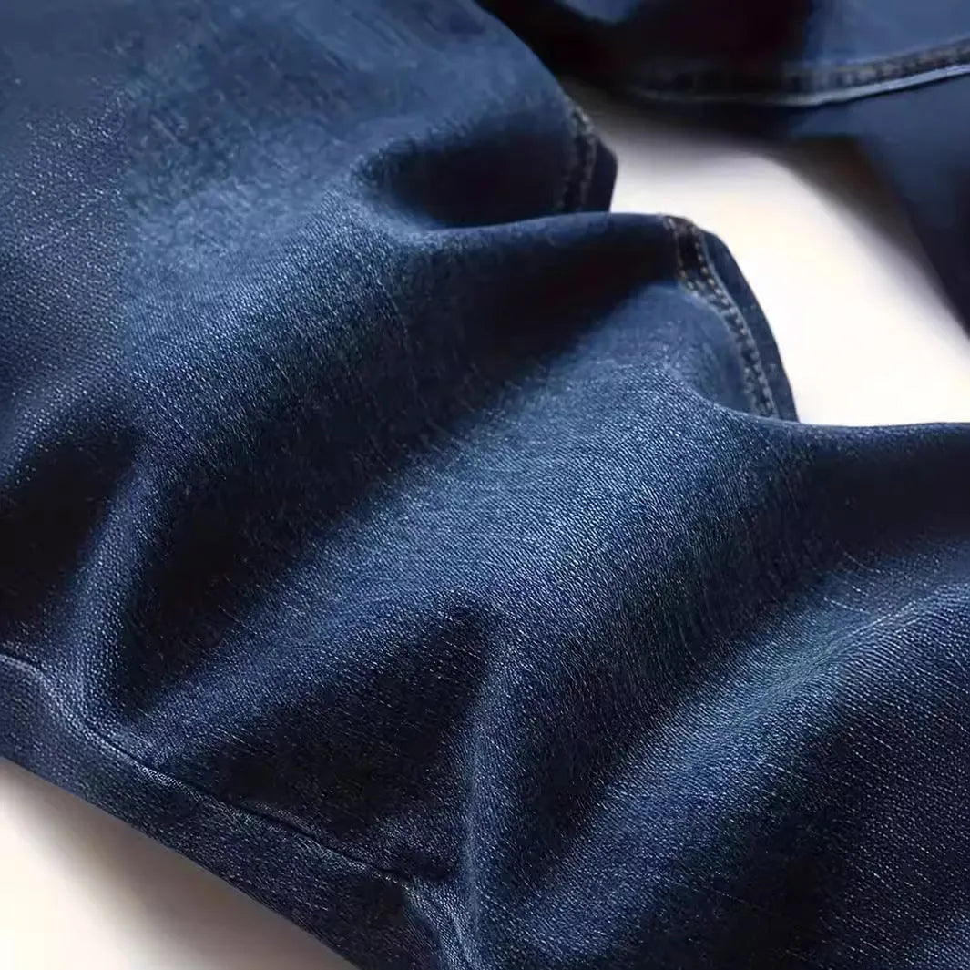 Men's dark blue slim fit cotton jeans with skinny leg opening and mid waist