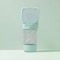Green pink and white 3-in-1 portable pet water bottle with food container and waste bag dispenser