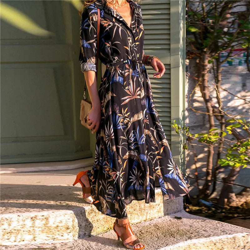 V-neck chiffon dress with printed pattern and A-line skirt on a hanger.