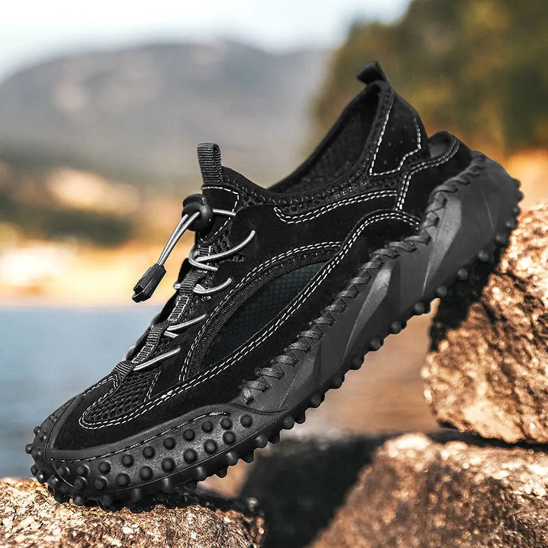 Men's black outdoor sports sandals with leather mesh upper and rubber sole showing elastic band closure