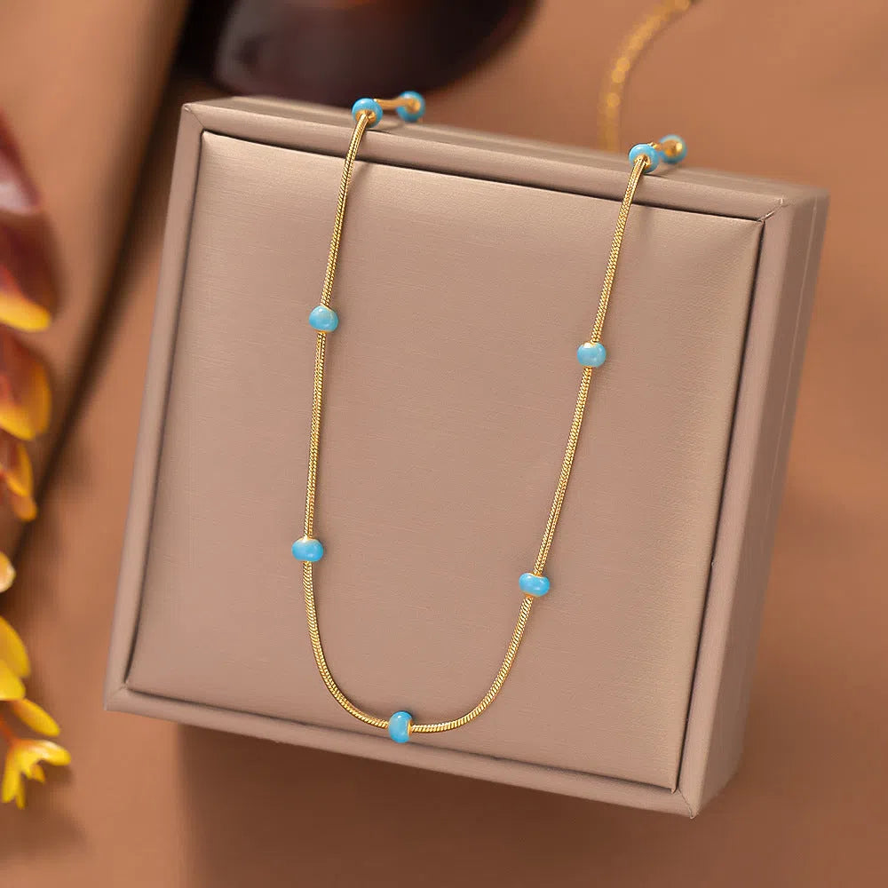 Titanium steel ball drop glaze necklace on stainless steel clavicle chain in Green Pearl Gold