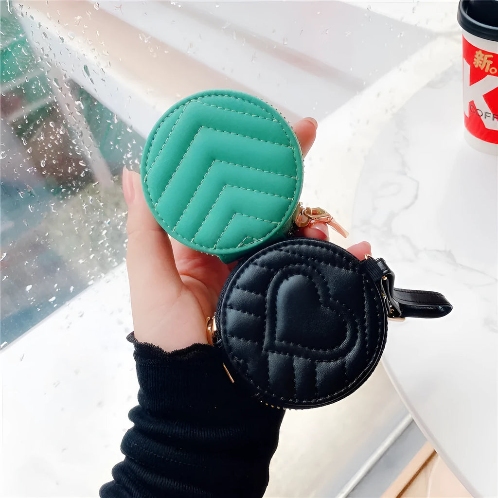 Wallet-style Bluetooth headset protective case with zipper and imitation leather finish in green, pink, red, purple, or black.