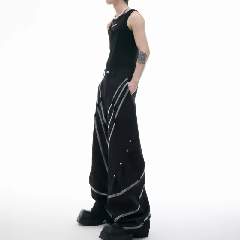 Men's polyester trousers with metal striped rivets and pleated detailing in black or white options