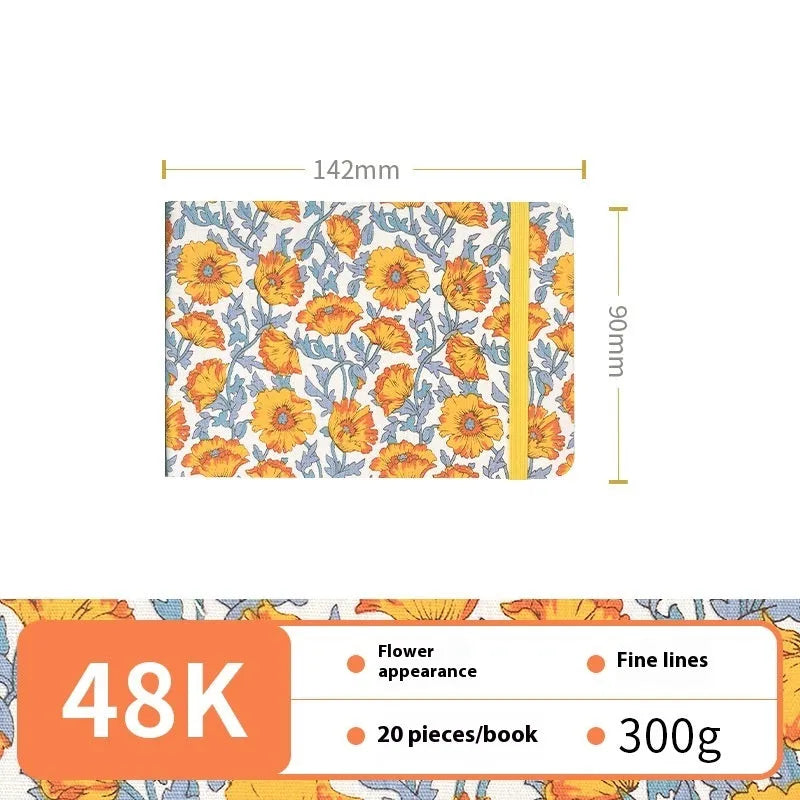 Feiluniao handmade fabric watercolour notebook open on a table with paints, showing a decorative cover.