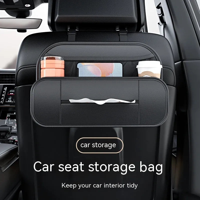 Black leather storage bag attached to the back of a car seat for organisation.