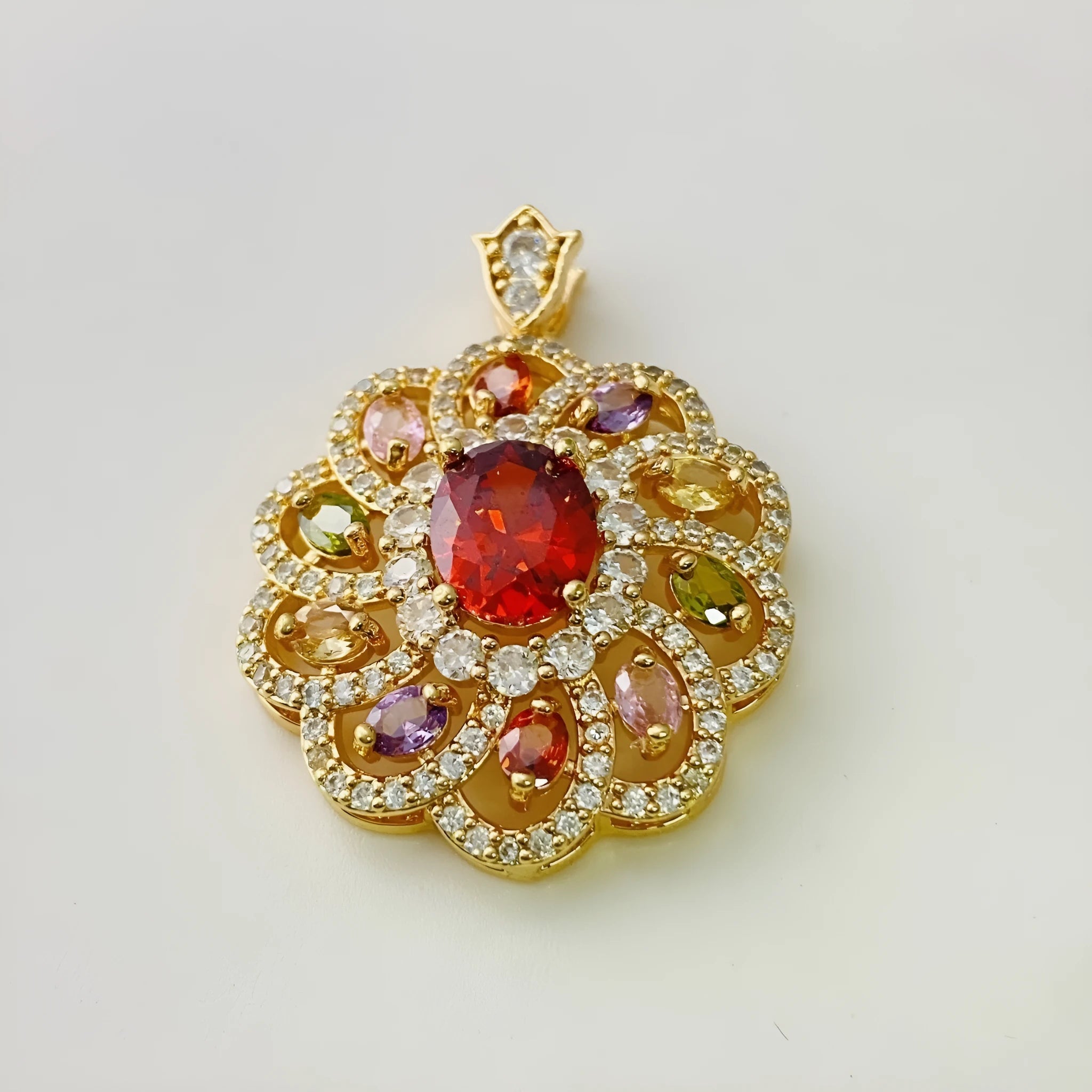 Close-up of a women's floral-shaped zircon pendant necklace in a gold electroplated finish, shown with a delicate chain.