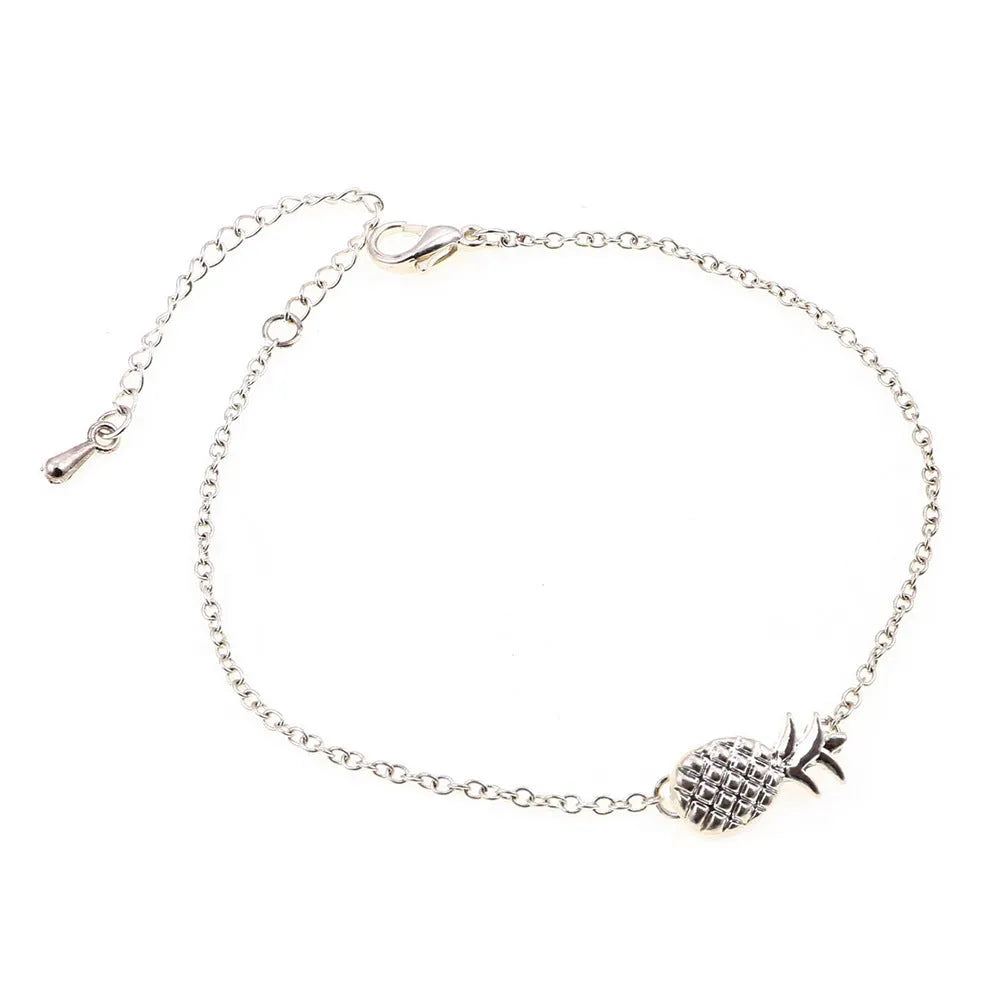 Gold or silver alloy bracelet with a detailed pineapple charm on a simple chain.