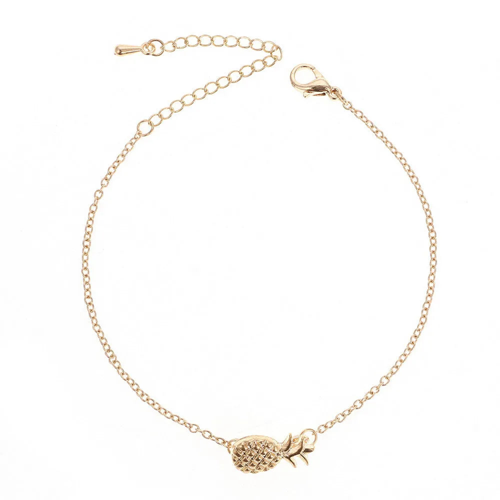 Gold or silver alloy bracelet with a detailed pineapple charm on a simple chain.