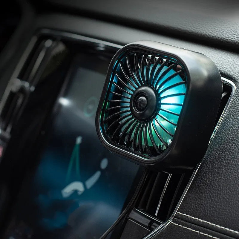 USB car fan with three-speed controls and charging cable for vehicle dashboard use