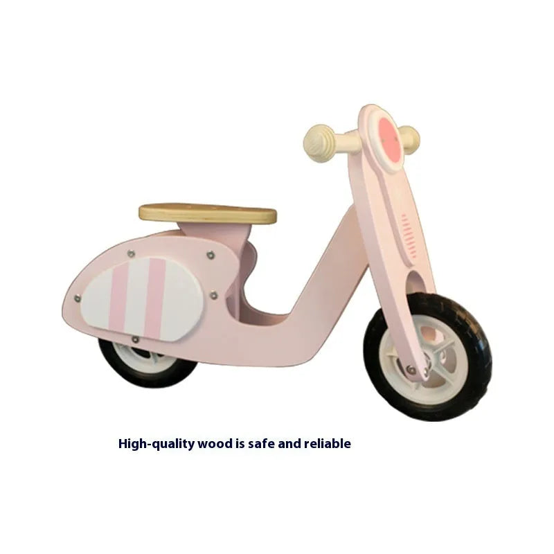Pink wooden balance scooter for toddlers aged 1 to 6 years, 10 inches long.