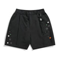Black men's casual shorts with a button fly and semi-elastic waistband on a plain background.