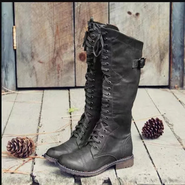 Women's black chunky heel high leg ankle boot with round toe and low rubber sole