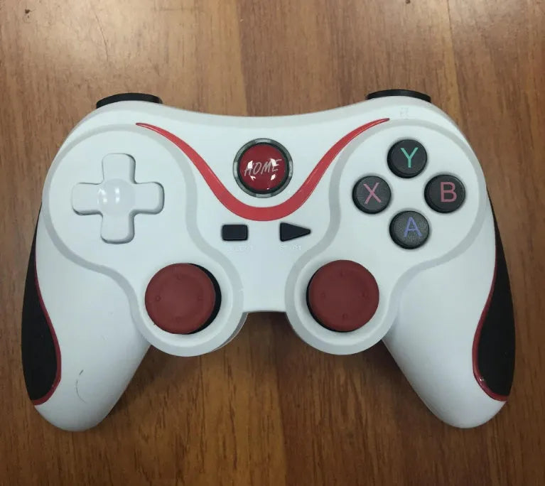 Black X3 wireless Bluetooth Android game controller with phone clip attached to smartphone