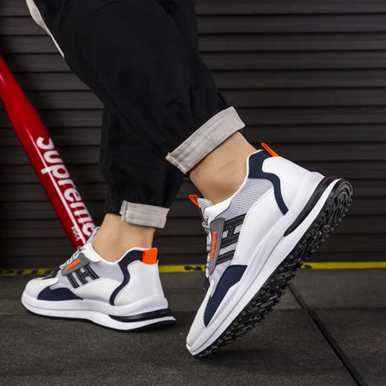 Men's sports sneakers in light grey or black with PU and mesh upper, front tie fastening, plastic sole, sizes 39-44