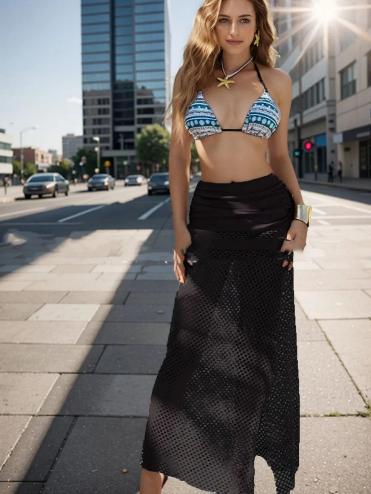 Women's brown gradient bikini and fishnet long skirt three-piece swimwear set laid flat.