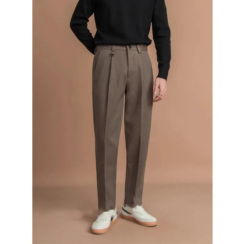 Men's straight leg polyester trousers in black, shown laid flat to display the cut and drape.