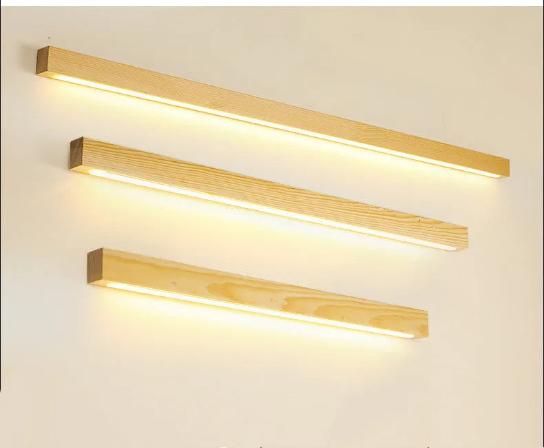 Modern walnut colour wood and acrylic wall lamp with LED lighting in minimalist log strip design