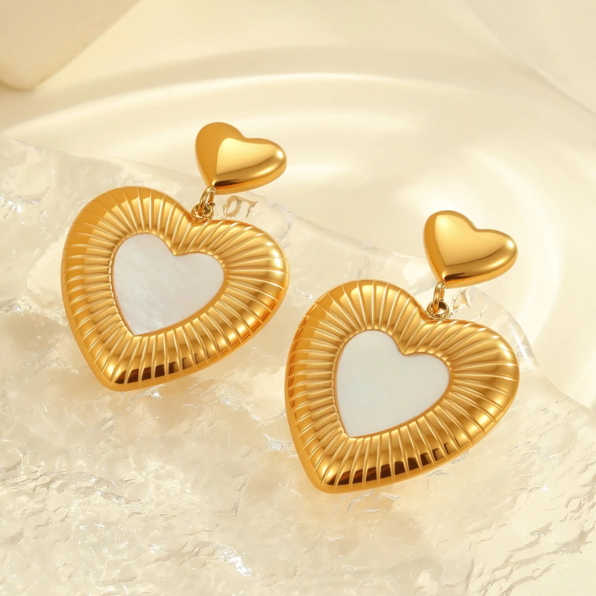 Gold-coloured heart-shaped stainless steel earrings with electroplated finish for women