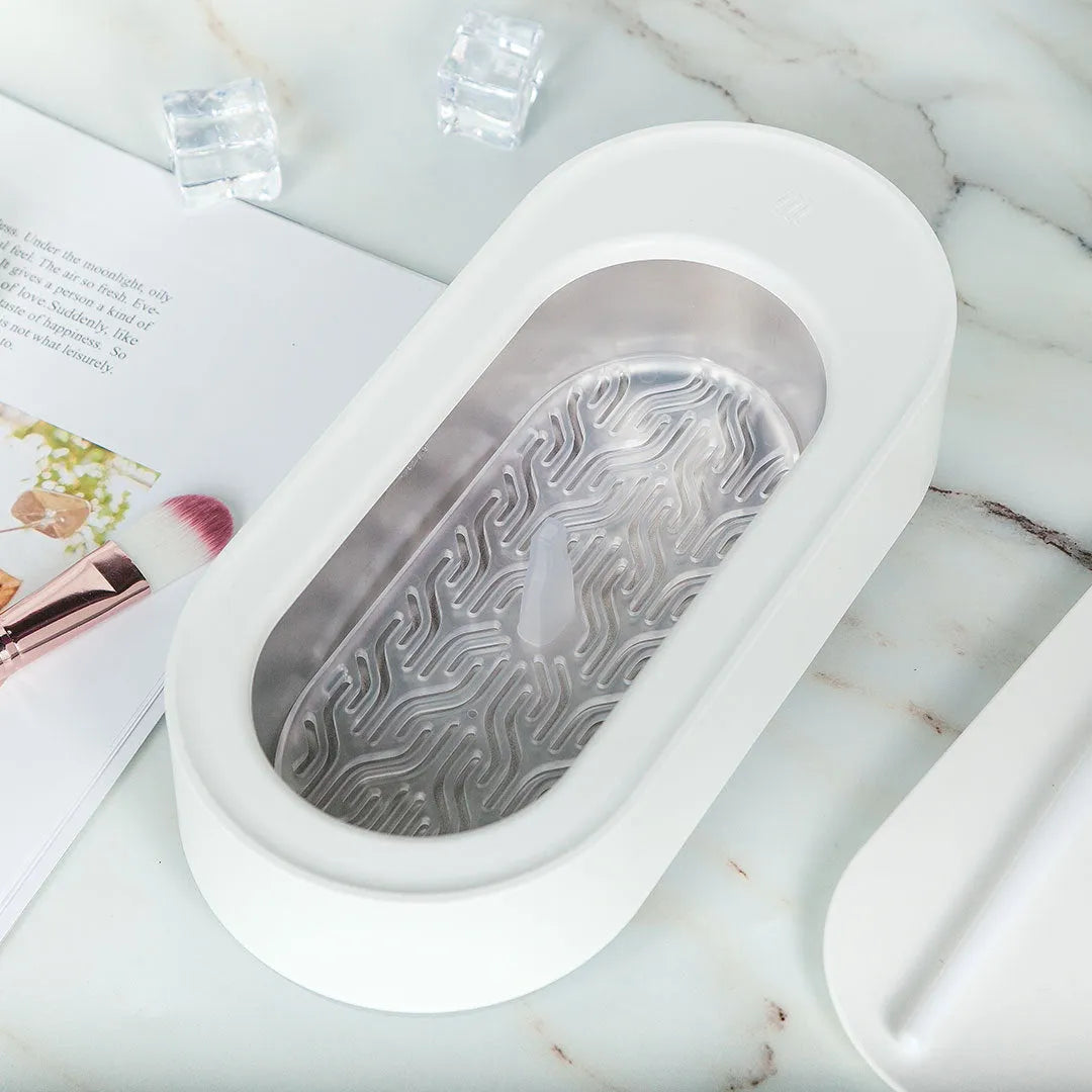 White portable ultrasonic cleaning machine with display and stainless steel tank.
