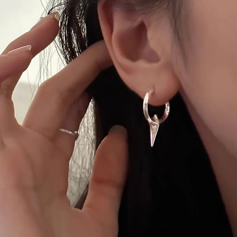 Platinum electroplated geometric star-shaped clip-on earrings for women.