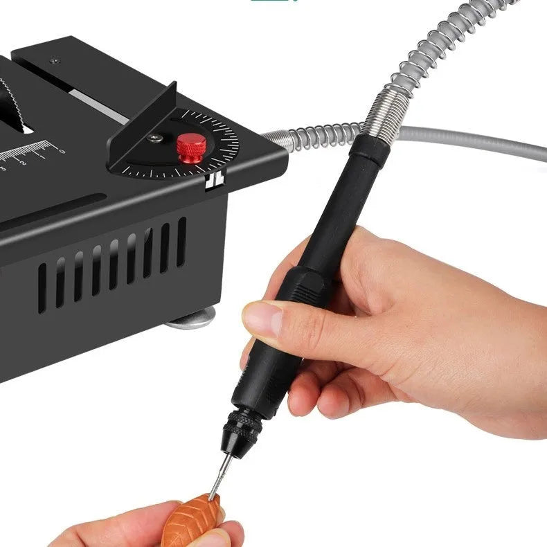 Cordless lithium ion handheld micro desktop saw on a workbench.