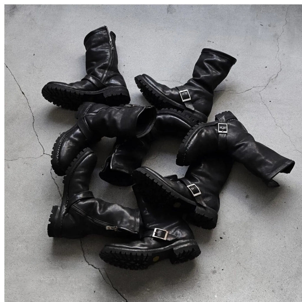 Men's black retro Martin boots with side zipper and round toe on a plain background.
