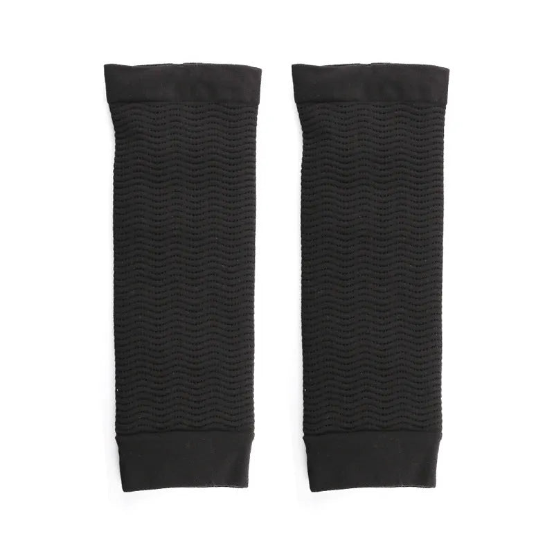 A pair of women's black shaping arm sleeves made from nylon fabric.