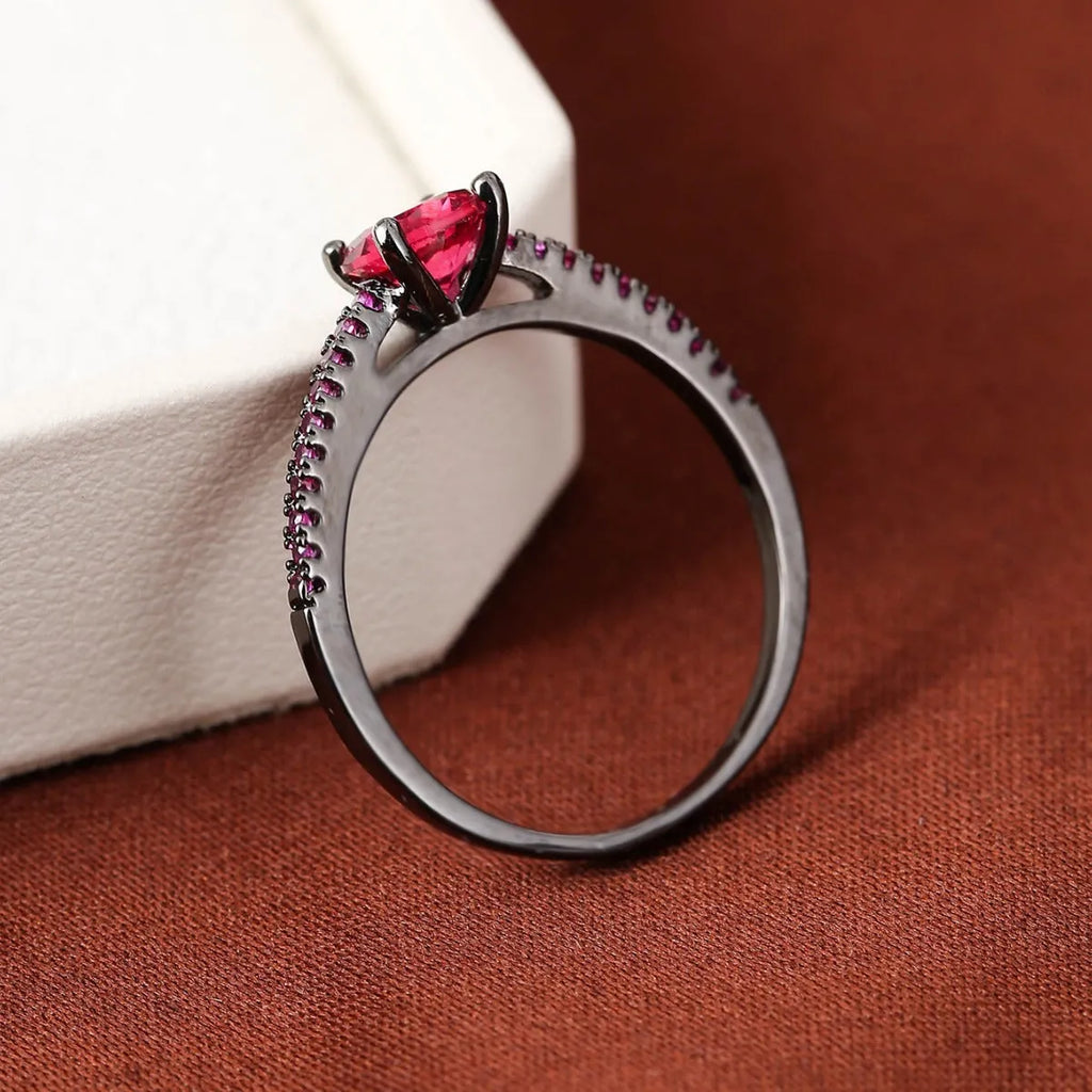 Geometric hexagon zircon fashion ring in electroplated copper on a hand, showing gold and gun black colour options.