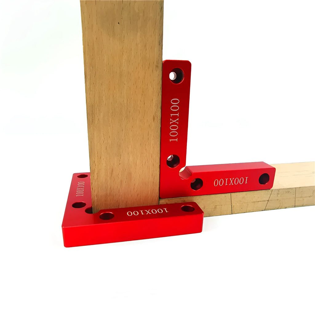 Aluminium right angle woodworking positioning block or jig on a workbench.