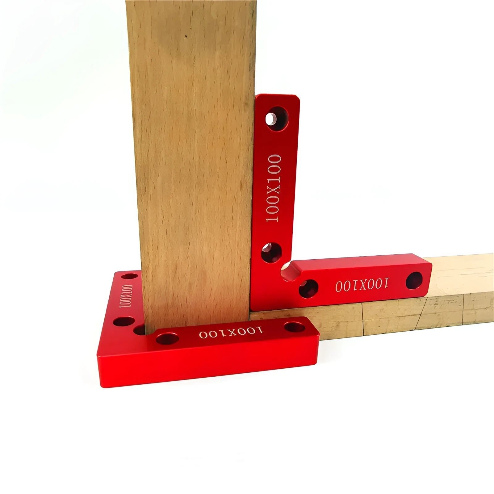 Aluminium right angle woodworking positioning block or jig on a workbench.